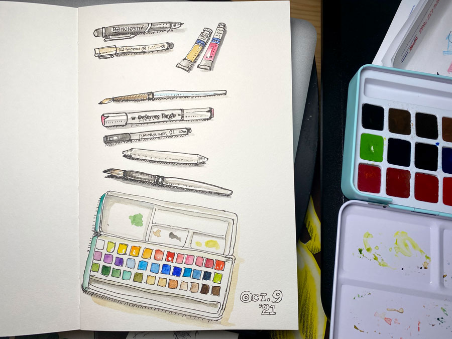 Sketch book page with illustration of pens, art materials using pen and watercolour